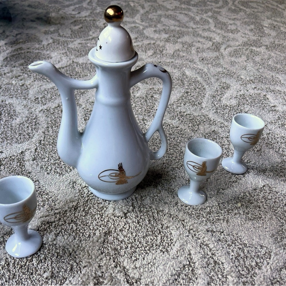 Turkish Tea Set. Porcelain. One of the cups has been repaired.